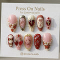 Almond-shaped press on nails with strawberry and heart 3D nail art