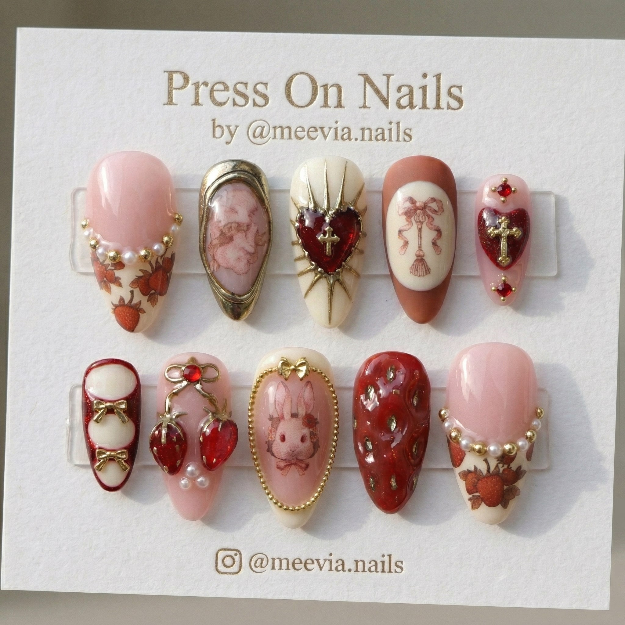 Almond-shaped press on nails with strawberry and heart 3D nail art