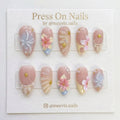 Almond-shaped 3D floral and shell press-on nail set with ocean motifs and pearls