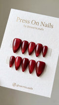Almond-shaped deep red shimmer press-on nail set with a galaxy effect
