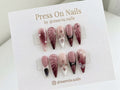 Stiletto-shaped mauve and burgundy press-on nail set with 3D floral art and pearls