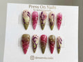 Stiletto-shaped berry and olive green press on nails with 3D textures and gold studs