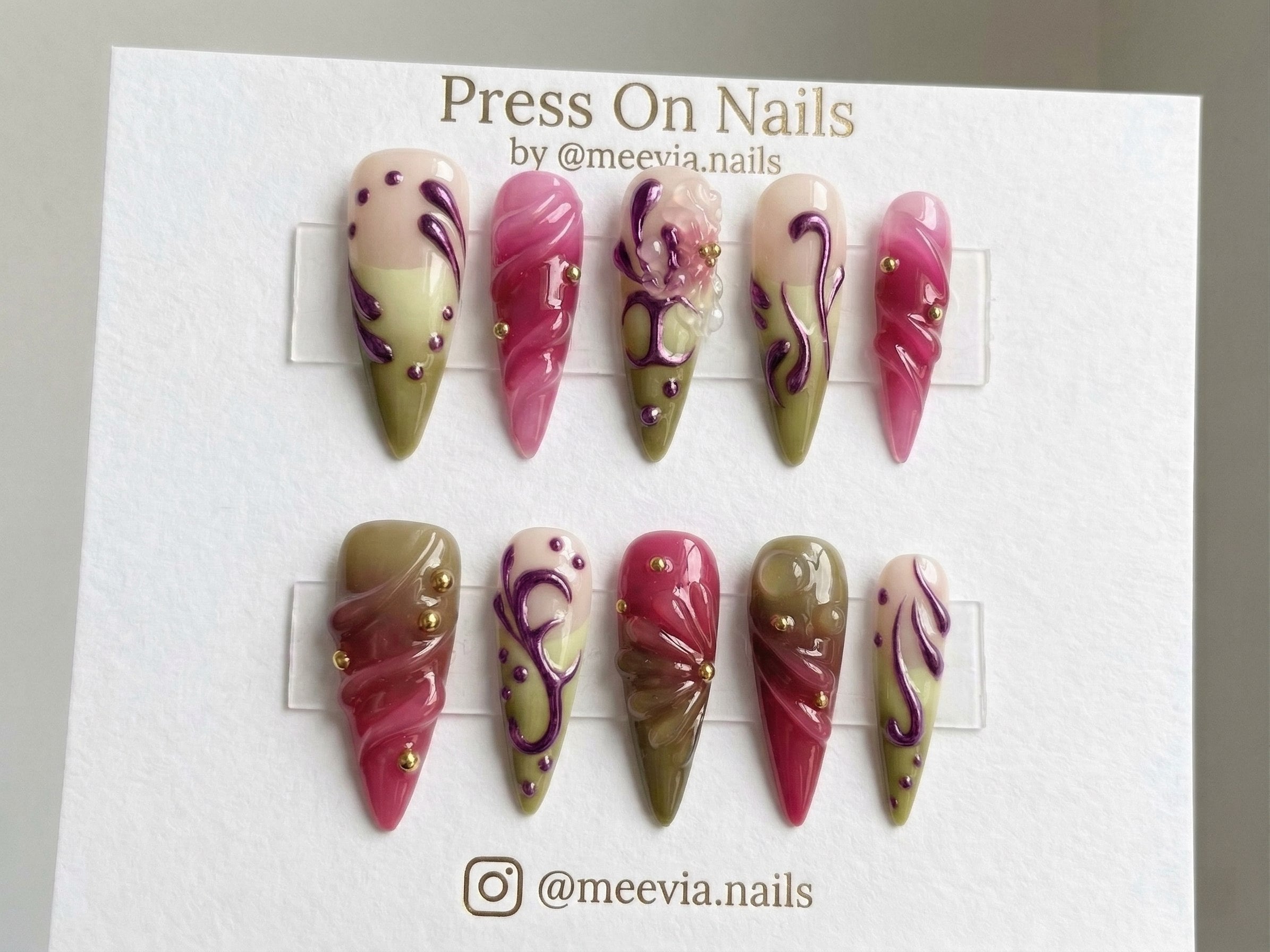 Stiletto-shaped berry and olive green press on nails with 3D textures and gold studs