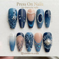 Long coffin-shaped oceanic blue nail set with 3D pearl and butterfly nail art