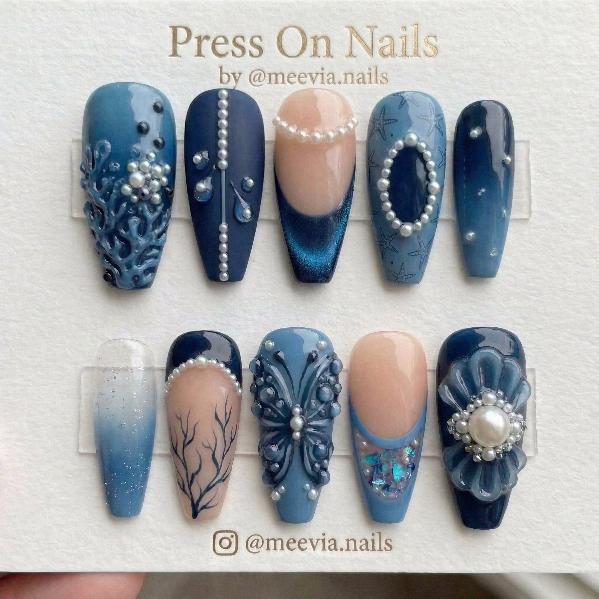 Long coffin-shaped oceanic blue nail set with 3D pearl and butterfly nail art