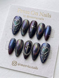 Stiletto-shaped pink press-on nail set with 3D silver chrome swirls and black star accents