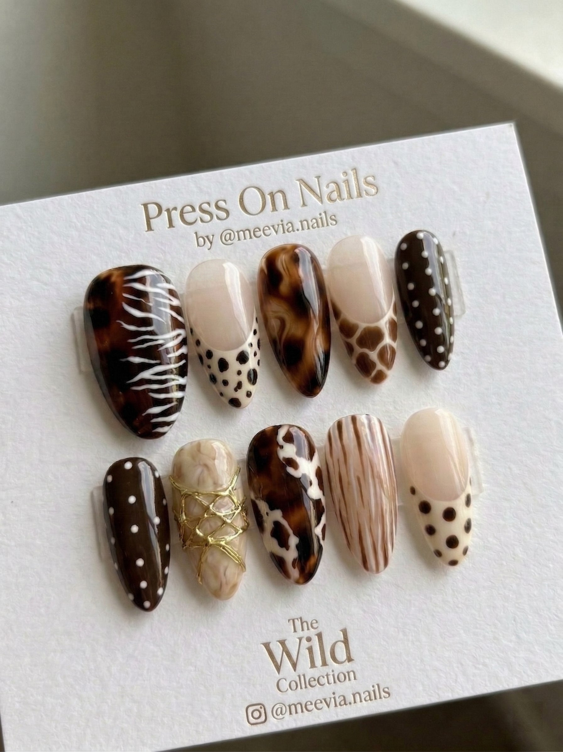 Almond-shaped animal print press on nails with tortoiseshell and 3D gold details
