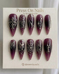 Long stiletto-shaped purple jelly press-on nails with silver 3D chrome spider web and circuit board nail art