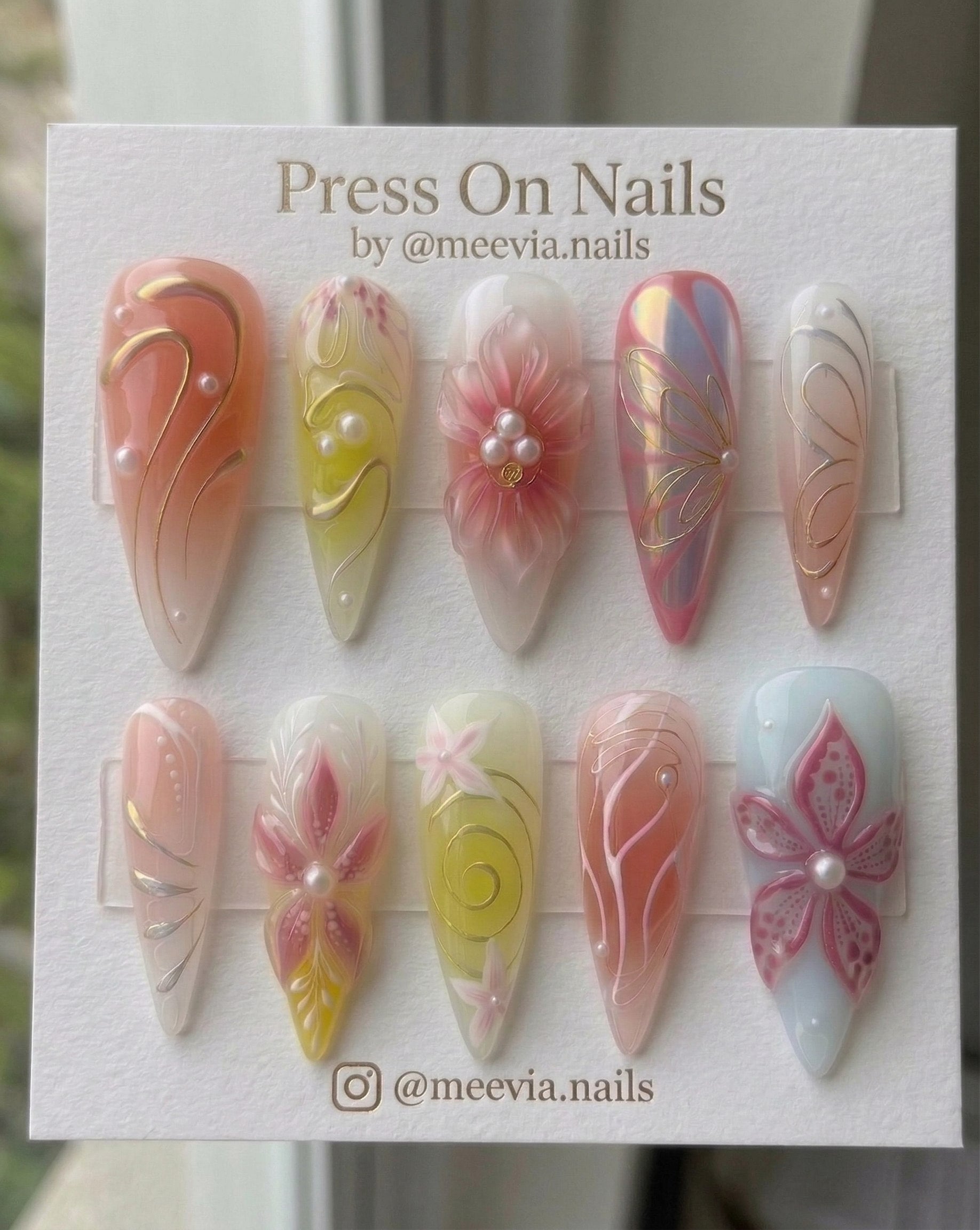 Stiletto-shaped iridescent press-on nail set with 3D floral art and pearls