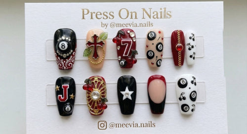 Coffin-shaped black and red press-on nail set with 8-ball and cherry 3D nail art motifs