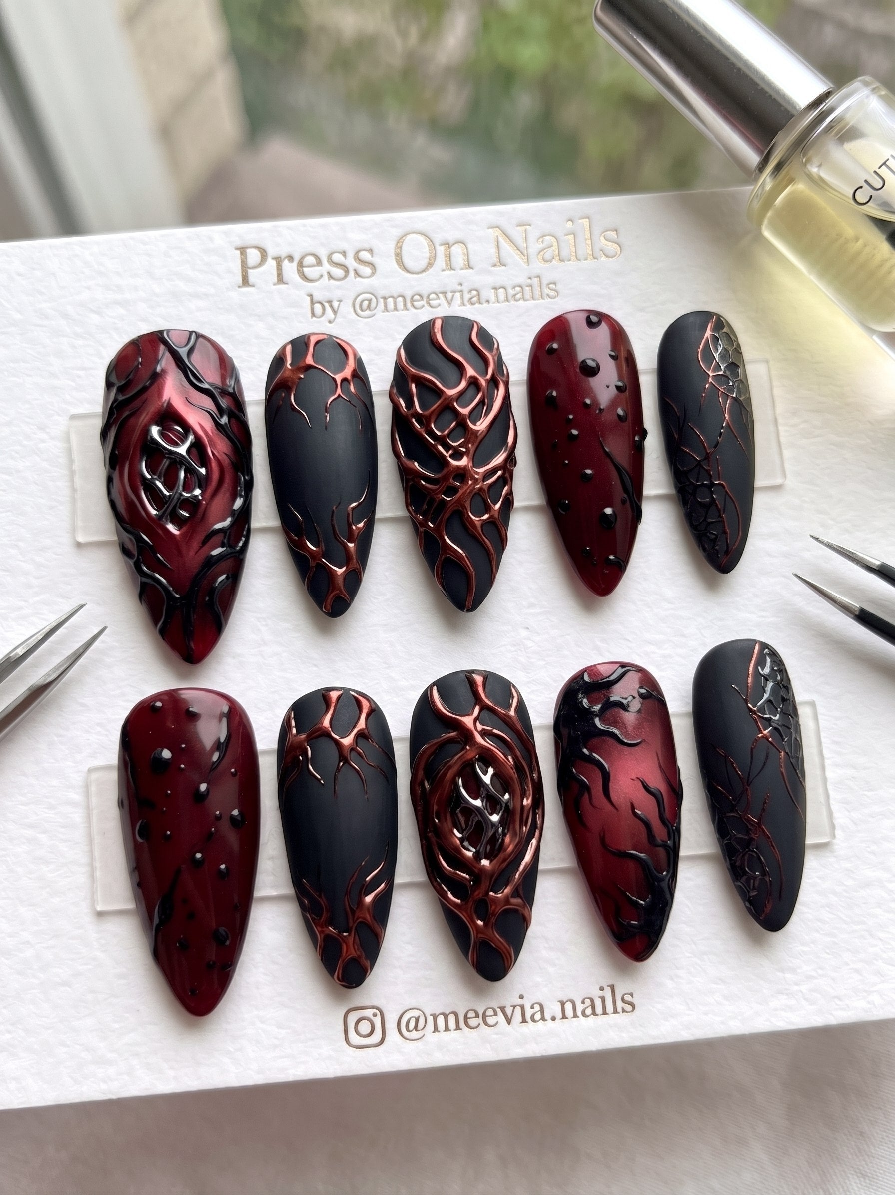Stiletto-shaped pink press-on nails with 3D star charms and silver metallic accents