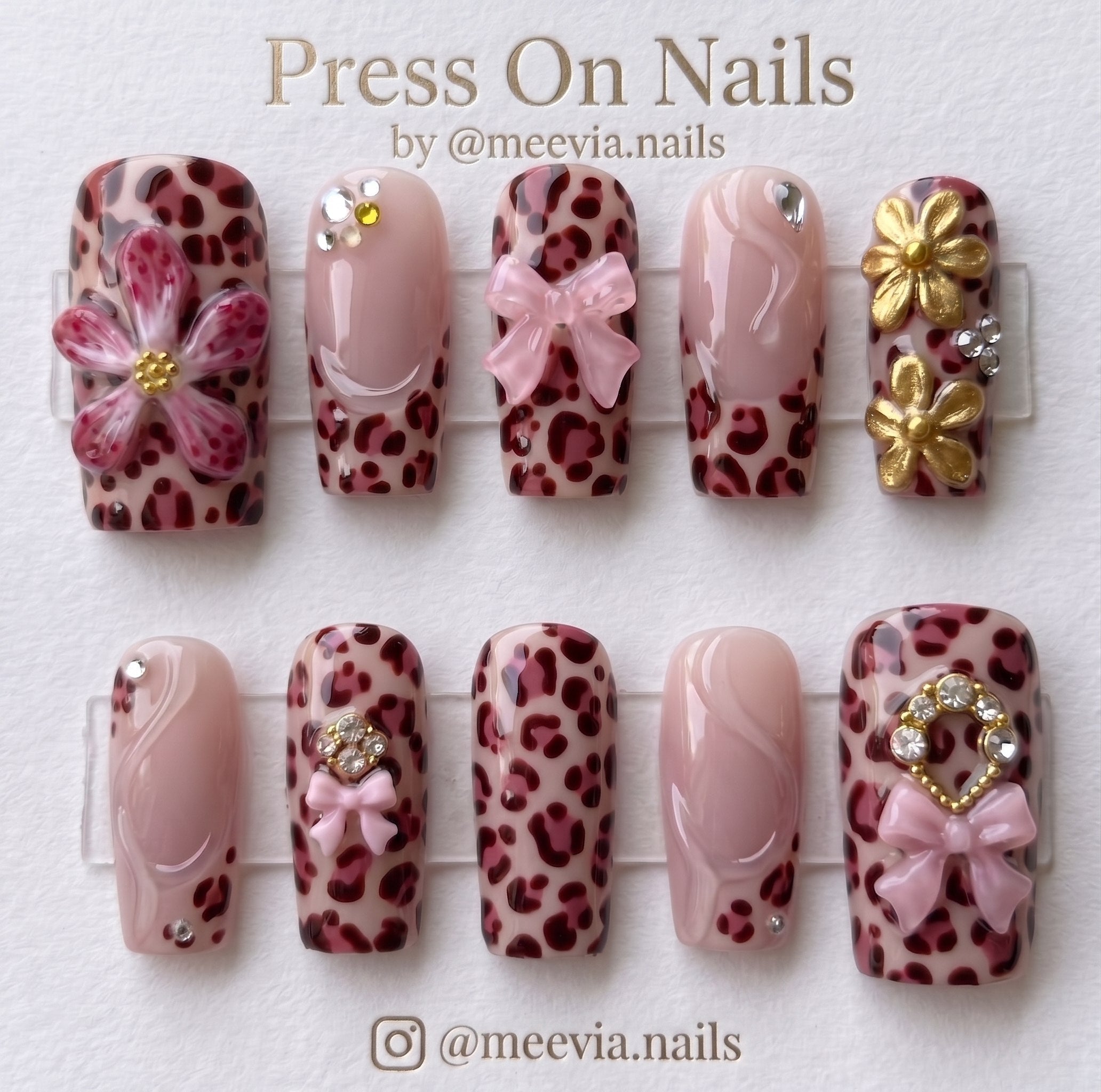 Square pink leopard print press-on nails with 3D bows and gold flowers