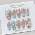 Almond-shaped ocean pearl press on nail set with 3D seashells and blue ombre tips