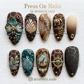 Almond-shaped safari press-on nail set with giraffe print, 3D elephant charms, and latte art designs