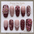 Coffin-shaped mauve leopard print press on nails with 3D pink flowers and bow