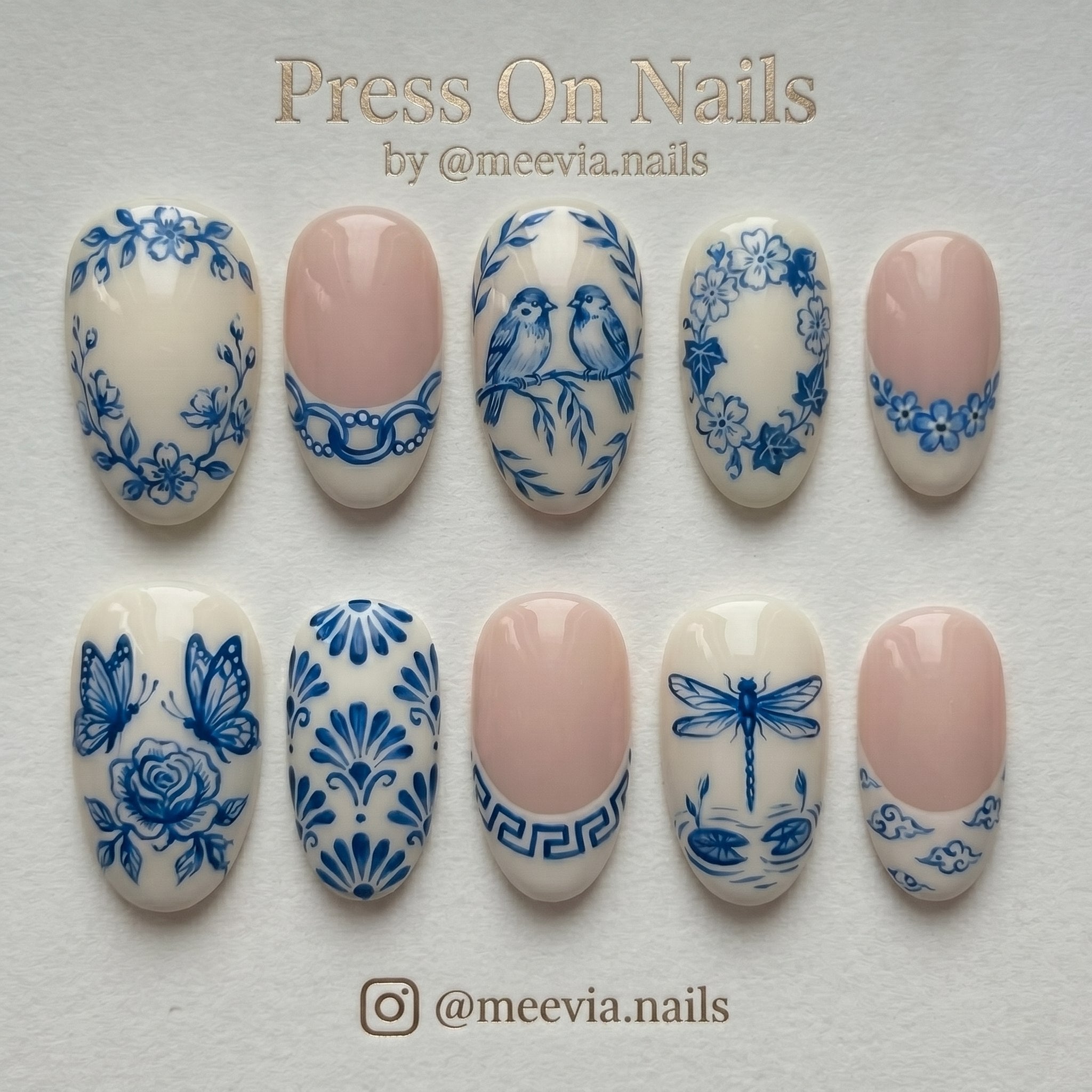 Oval-shaped blue and white porcelain style press-on nail set with bird and floral motifs