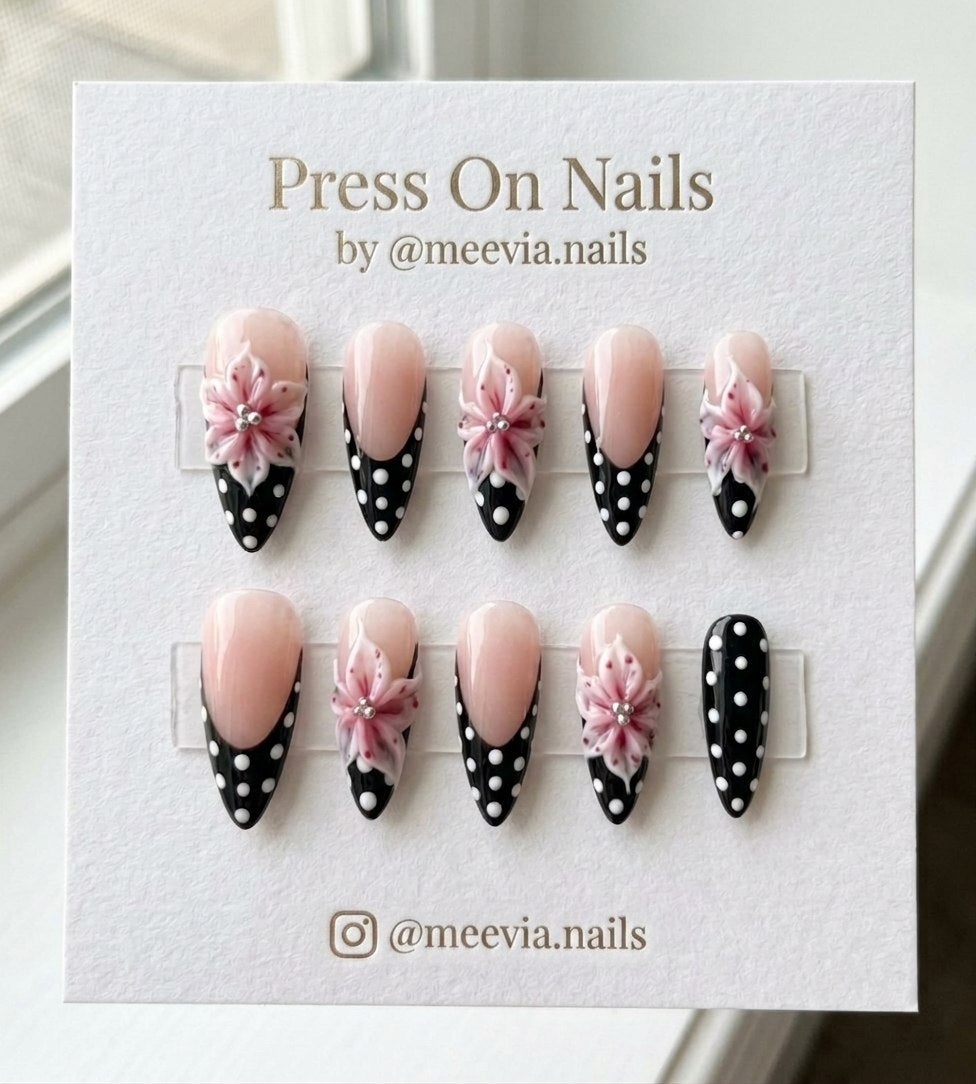 Almond shaped press on nails with 3D pink flowers and black polka dot French tips