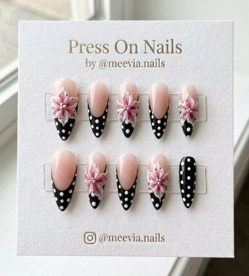 Almond shaped press on nails with 3D pink flowers and black polka dot French tips