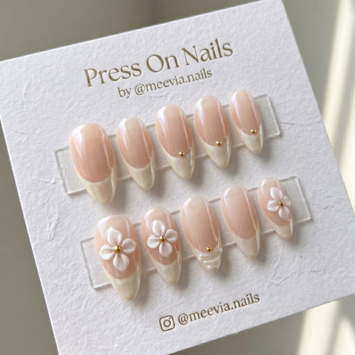 Almond-shaped French tip press on nails with 3D floral art and glazed shimmer finish