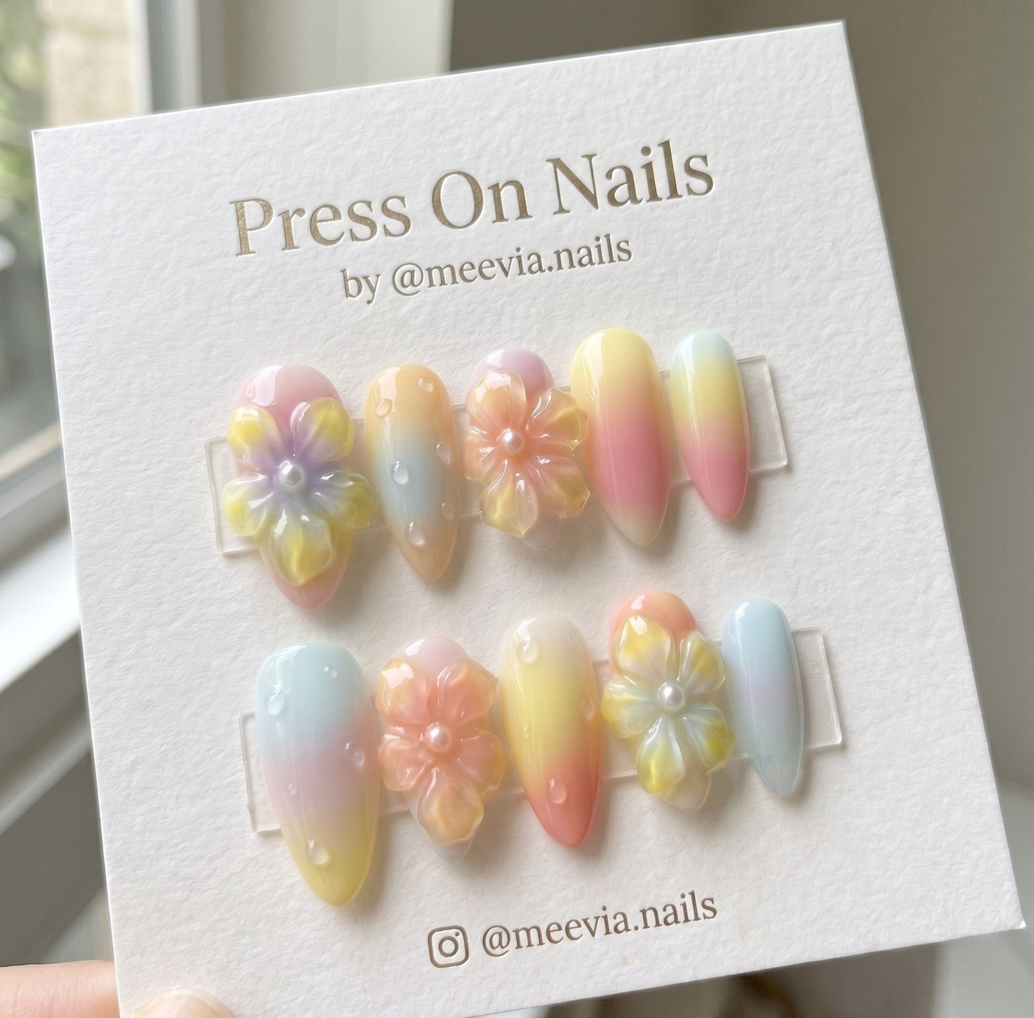 Almond-shaped pastel gradient press on nail set with 3D floral and water droplet accents