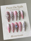 Long stiletto press-on nail set with pink gradient, 3D silver molten metal art, and an iridescent heart.