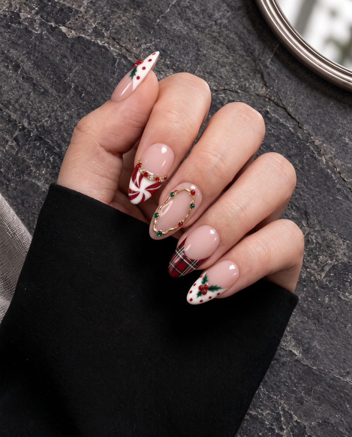 Pink Christmas press-on nails with plaid tips, holly berries, peppermint swirls, and glossy finish
