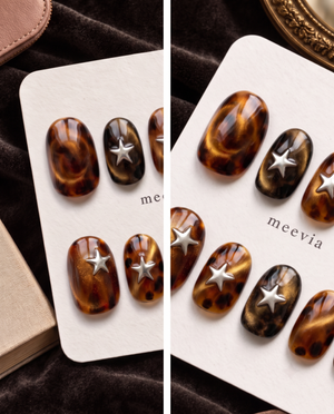 Tortoise-shell cat-eye press-on nails with raised silver star embellishments