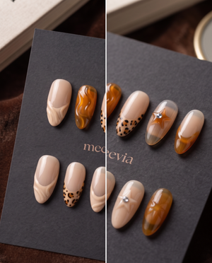 Nude and amber tortoiseshell swirl French tip press-on nails with spotted and rhinestone accents