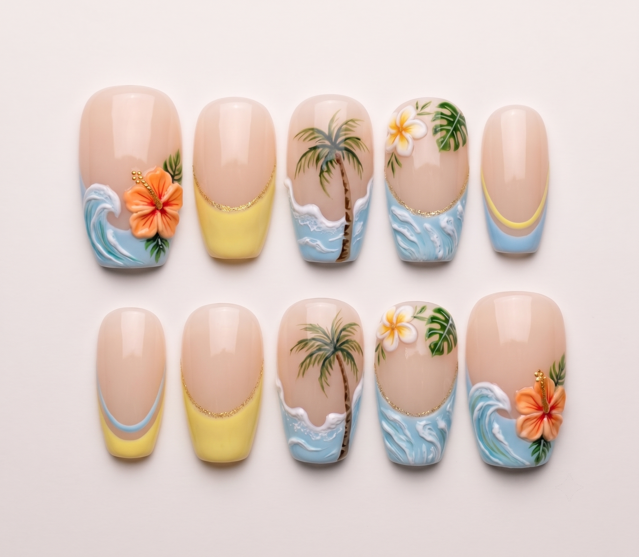 Tropical themed press-on nails featuring hibiscus flowers, palm trees, and wave designs on a nude base with French tips.
